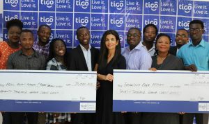 Tigo Ghana CEO, Roshi Motman, and staff of Tigo in a group picture with the winners