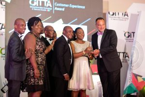 Jemima Kotei Walsh, Customer Relations Executive of MTN Ghana receiving one of the awards 