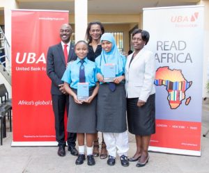 From (l-r), UBA Kenya Managing Director/CEO Isaac Mwige, Madam Bola Atta, CEO of the UBA Foundation, the Principal of the sch and the students