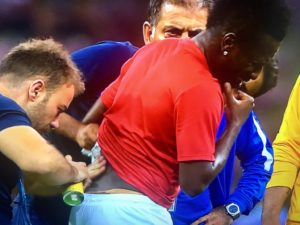 Asamoah Gyan in pain as he was treated on the pitch