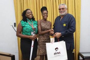  Dinah Coleman (L), Dzifa Amoa ( M) from Airtel Premier Team presenting Airtel souvenirs to Former president Jerry John Rawlings