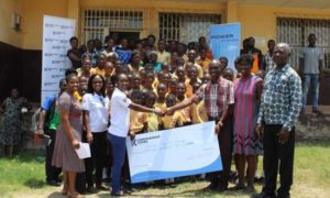 Karpower officials presenting a cheque to the schools 