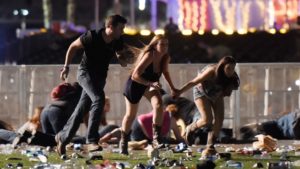People run after hearing gun fire at the the Route 91 Harvest country music festival [David Becker/Getty Images] 