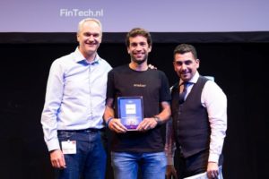 Oradian co-founder Julian Oehrlein on stage at the European FinTech event in Brussels accepting the award for Europe's Most Innovative Banking Software